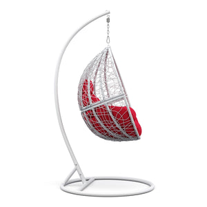 Eiersessel weiss mit roten Kissen