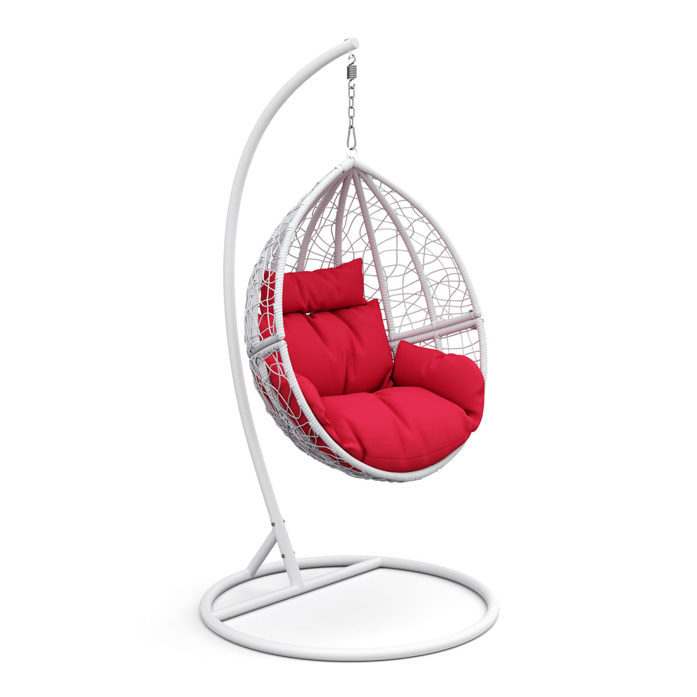Fauteuil œuf blanc avec coussins rouges