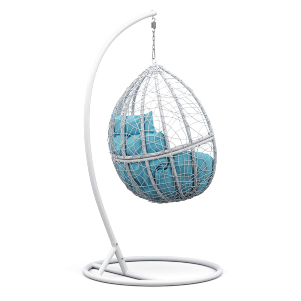 Eiersessel weiss mit türkisen Kissen