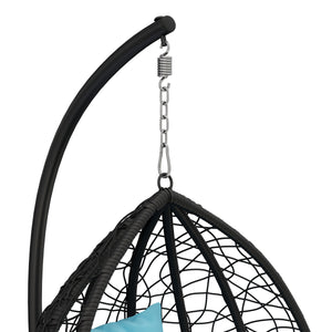 Eiersessel schwarz mit türkisen Kissen