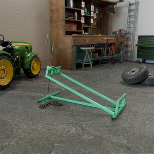 Rasentraktorheber mit Handschuhen - Grün